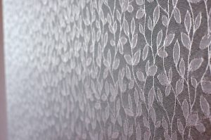 Ivy fabric close up, showing the texture and leaf design - Blinds Norfolk - Norwich Sunblinds