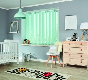 Aqua coloured vertical blackout blinds in a child's bedroom - Blinds Norfolk - Norwich Sunblinds