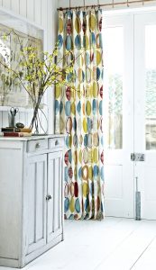 Full length curtains with brightly coloured abstract design fabric- Blinds Norfolk - Norwich Sunblinds