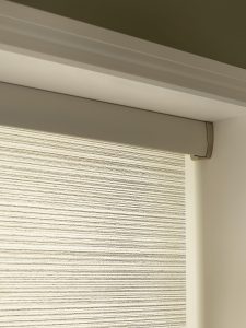 Close up of green and cream electric roller blind - Blinds Norfolk - Norwich Sunblinds