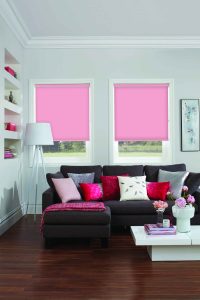 Bright pink roller blinds in living room - Blinds Norfolk - Norwich Sunblinds