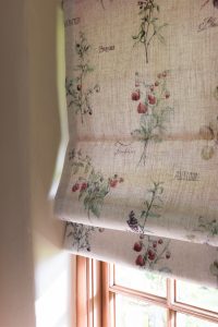 Close up of roman blind with cream background and delicate botanical print - Blinds Norfolk - Norwich Sunblinds