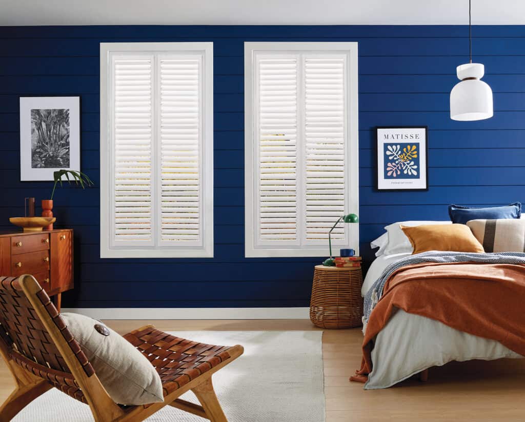 shutters in a bedroom setting from Norwich Sunblinds