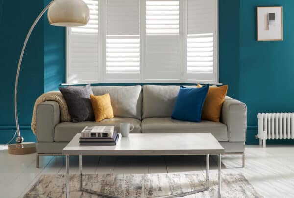 Antigua design plantation shutters in a living room setting